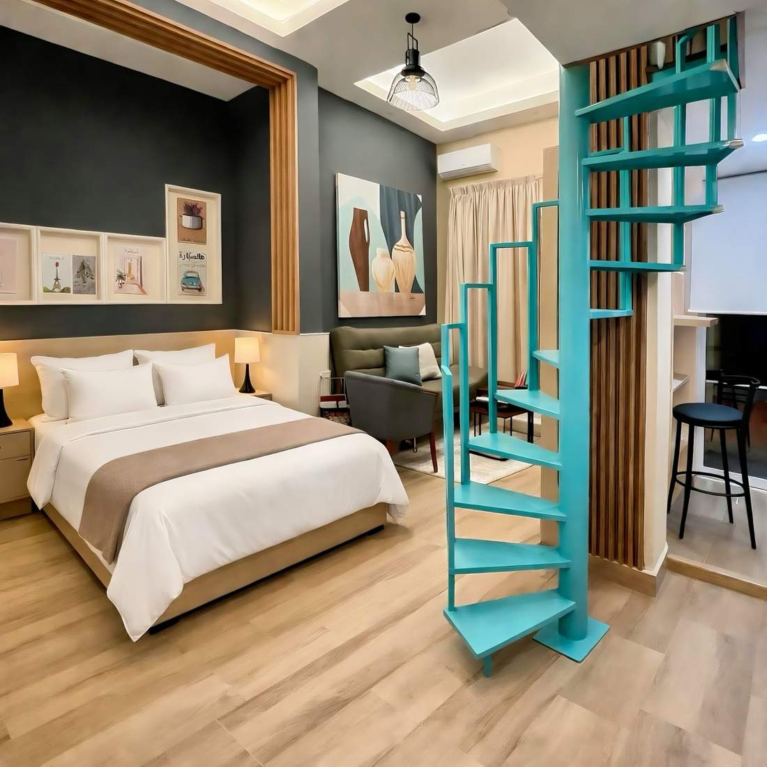 The Loft — duplex with teal spiral staircase
