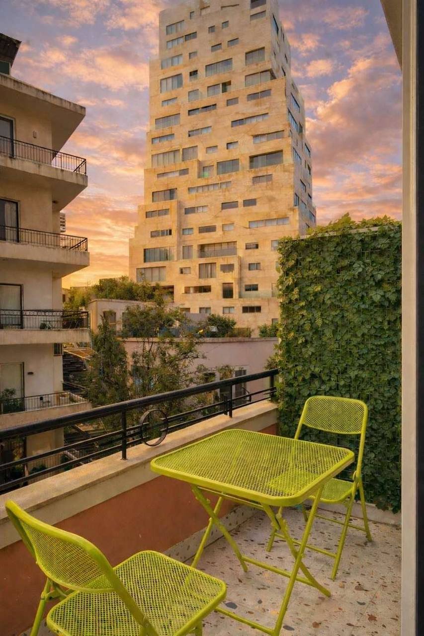 The Vibes balcony view onto Mar Mikhael at sunset